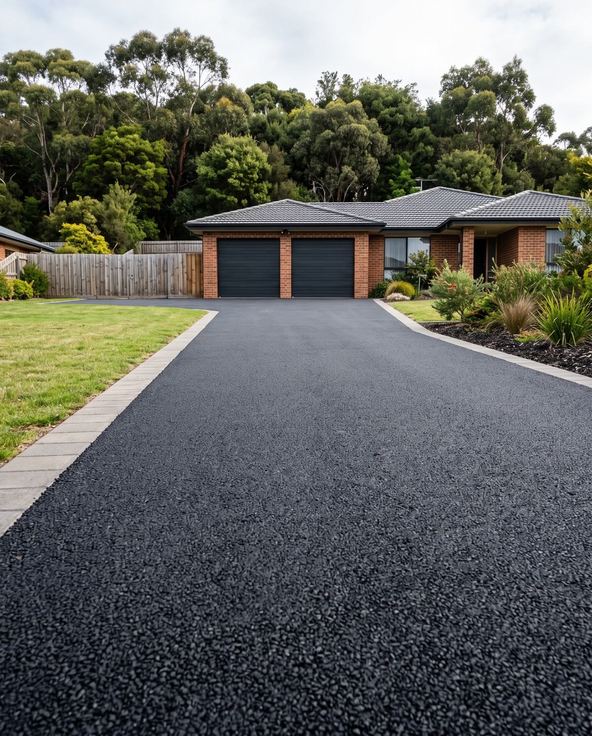 Freshly laid hotmix asphalt driveway at a Launceston home