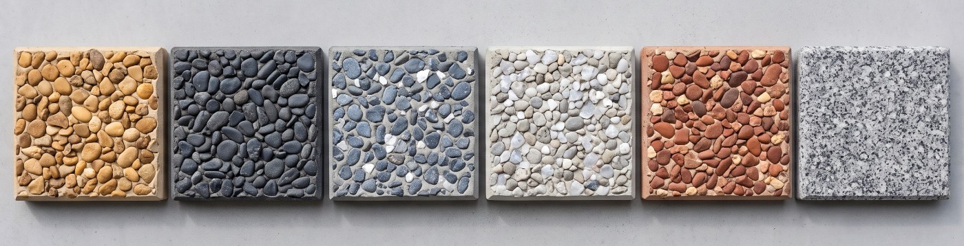 Six exposed aggregate blends laid out side by side as samples