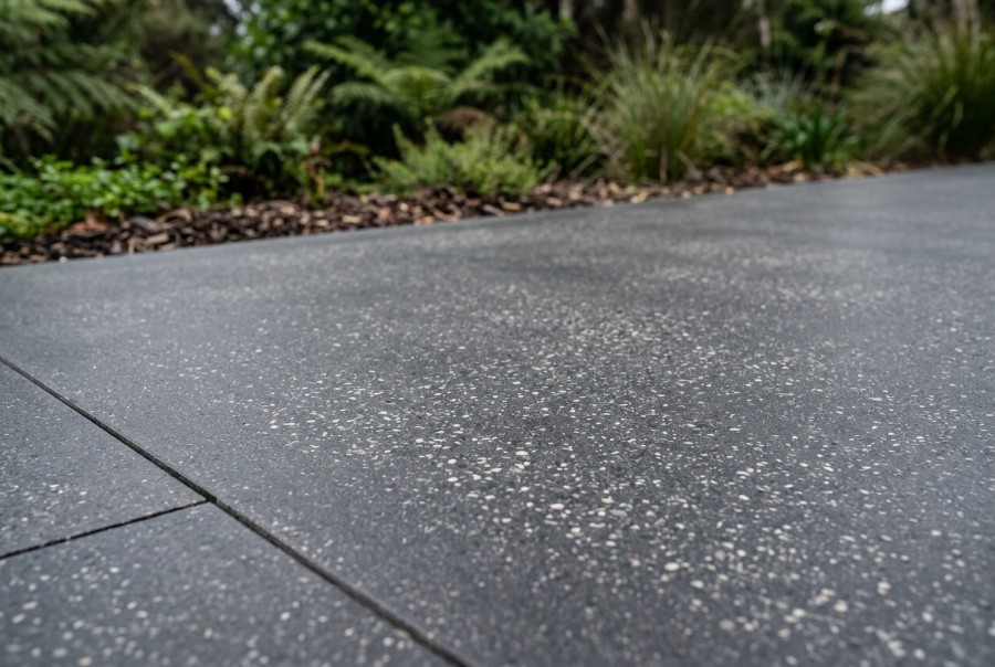 A charcoal honed concrete surface, close up