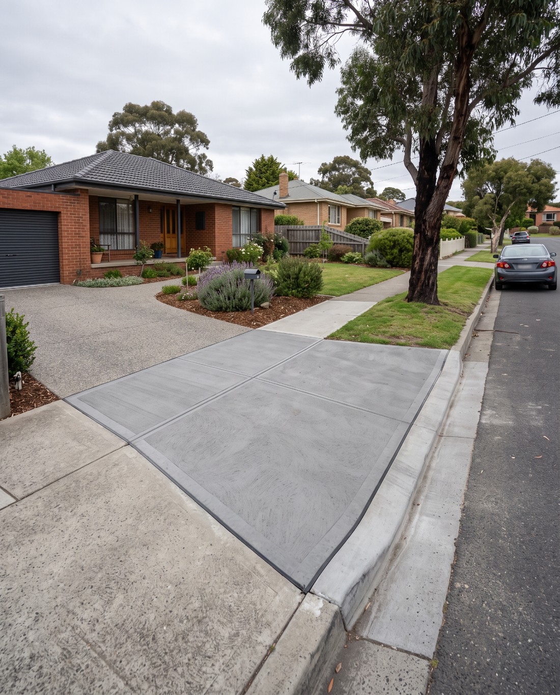 A finished driveway crossover meeting the property driveway in Launceston