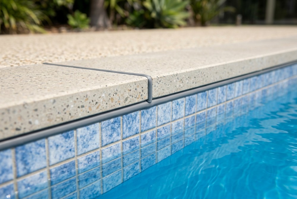 where it meets the shell on a concrete pool surround