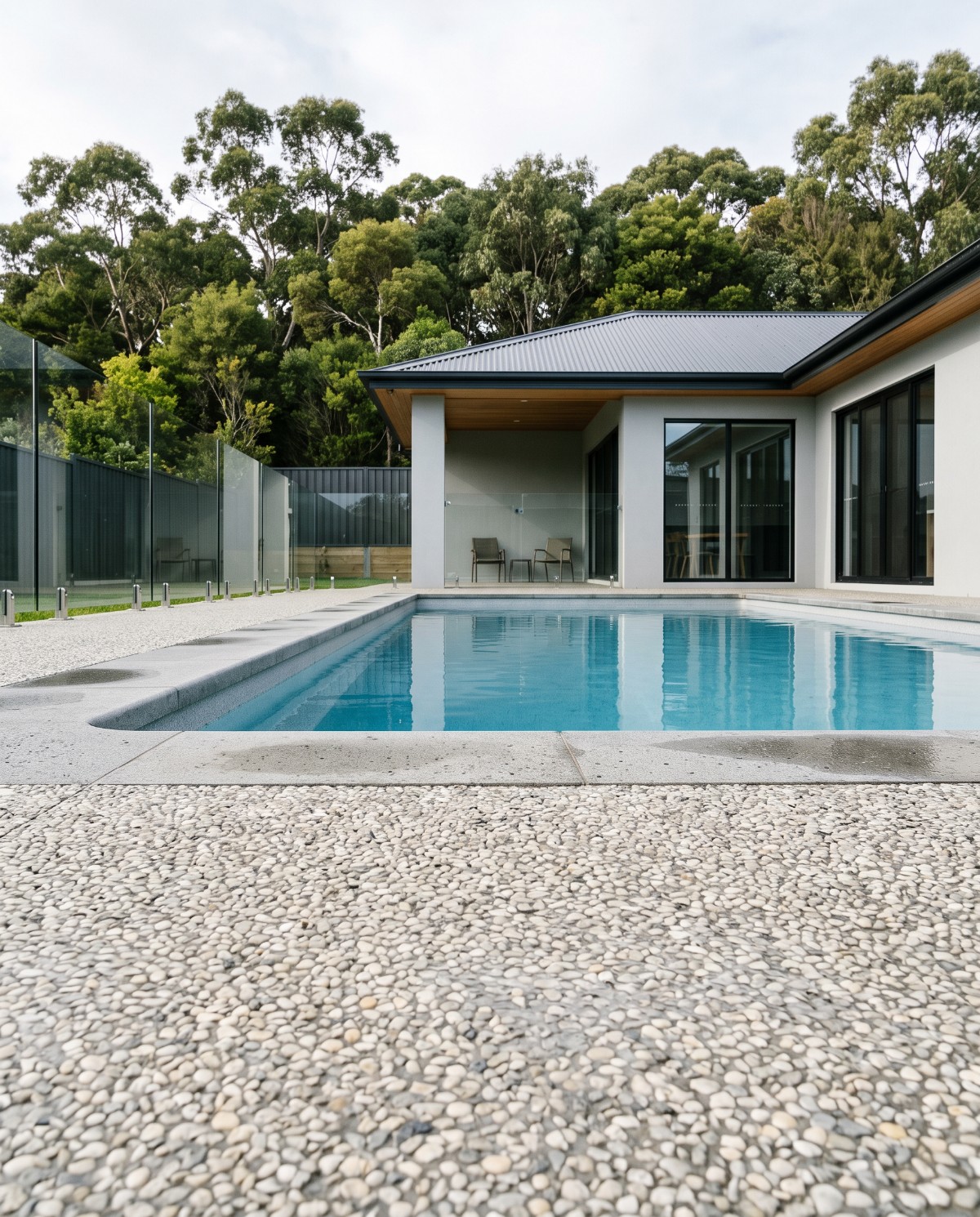 Exposed aggregate pool surround and bullnosed coping at a Launceston home